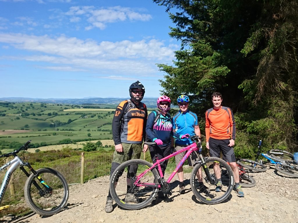 Ian, Kirsty, Ash and Dave enjoying the sun and views from the Red Trail at Llandegla