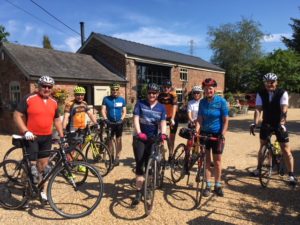 Active riders enjoying a sunny stop at Barnshaw Smithy